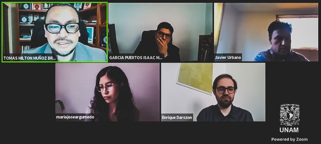 Captura de maestros discutiendo sobre migración y desarrollo